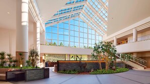 A spacious lobby with a high ceiling, a central seating area, and a staircase leading to upper levels. - The Westin Rusutsu Resort (Rusutsu)