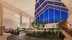 A spacious lobby with a central atrium, a staircase, and a seating area. - The Westin Rusutsu Resort (Rusutsu)