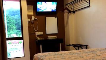 Desk, blackout curtains, iron/ironing board, rollaway beds