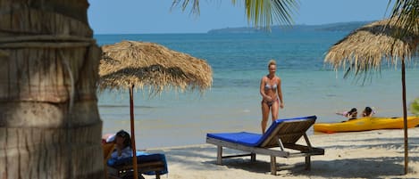 On the beach, sun loungers, beach umbrellas, beach volleyball