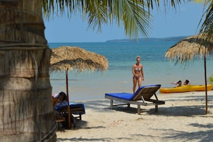 On the beach, sun loungers, beach umbrellas, beach volleyball
