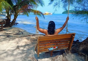 On the beach, sun-loungers, beach umbrellas, beach volleyball