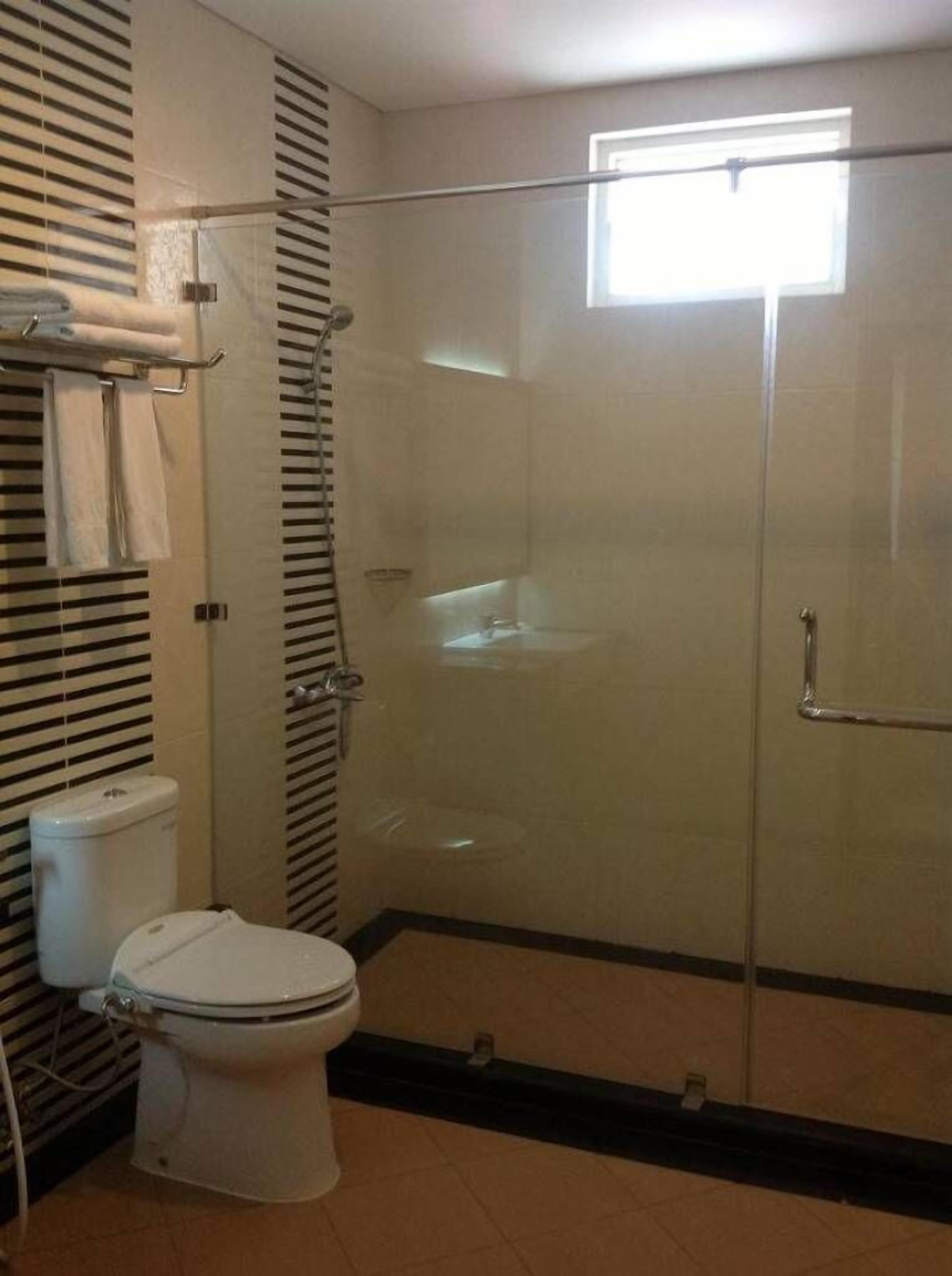 Shower, free toiletries, slippers, towels