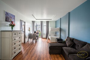 Studio Suite Super King and Bunk Bed, Balcony, Garden View | Living room | 32-inch flat-screen TV with cable channels, TV - Hong Mon Villa (Da Lat)