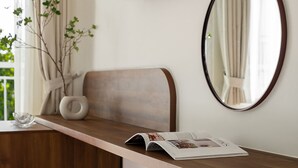A modern bathroom with a wooden vanity, a round mirror, a flat-screen TV, and a stone basin. - Hong Mon Resort Da Lat (Xuan Huong - Da Lat)