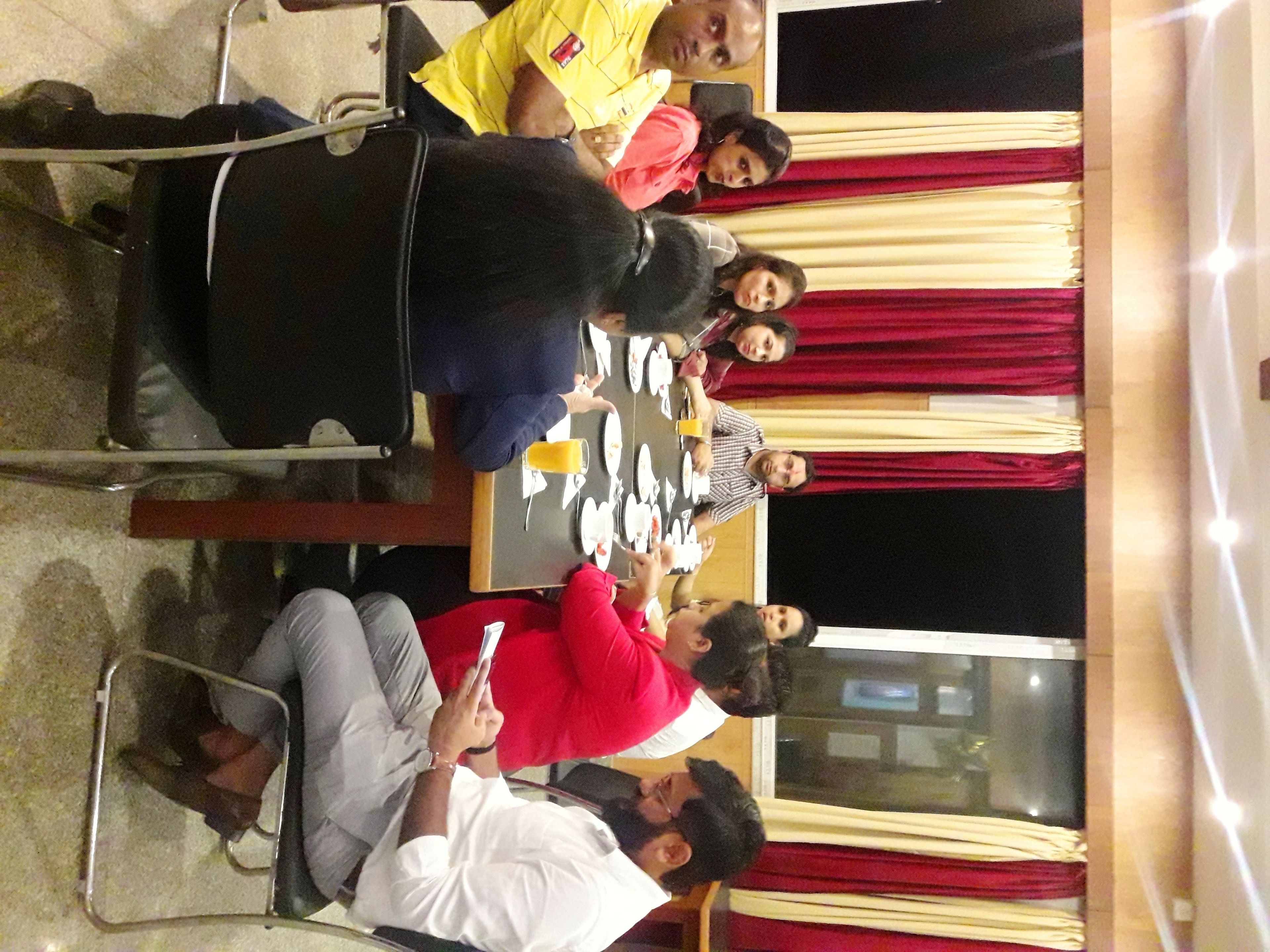 A conference room with a long table set for a meeting.