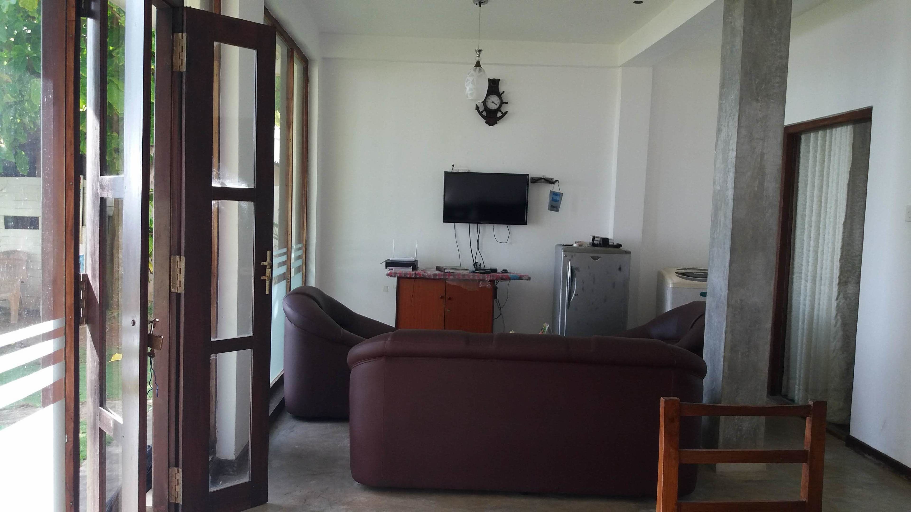 Standard Triple Room, 1 Bedroom, Sea View | Living area | 12-inch flat-screen TV with satellite channels, LCD TV