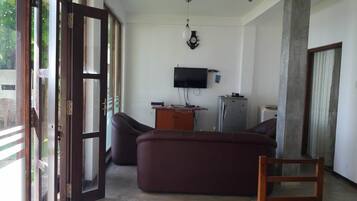 Standard Triple Room, 1 Bedroom, Sea View | Living area | 12-inch flat-screen TV with satellite channels, LCD TV
