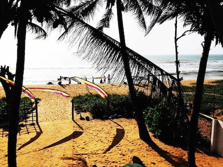 On the beach, 3 beach bars, surfing