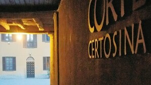 A corridor with a wall displaying the text "Corte Certosina". - Corte Certosina (Trezzano sul Naviglio)