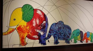 A colorful mural of elephants. - Navavilla (Khlong Luang)
