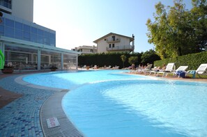 Seasonal outdoor pool, an infinity pool, pool loungers