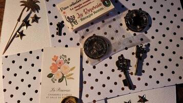 A hotel brochure titled "La Roseraie" with a polka dot tablecloth background.