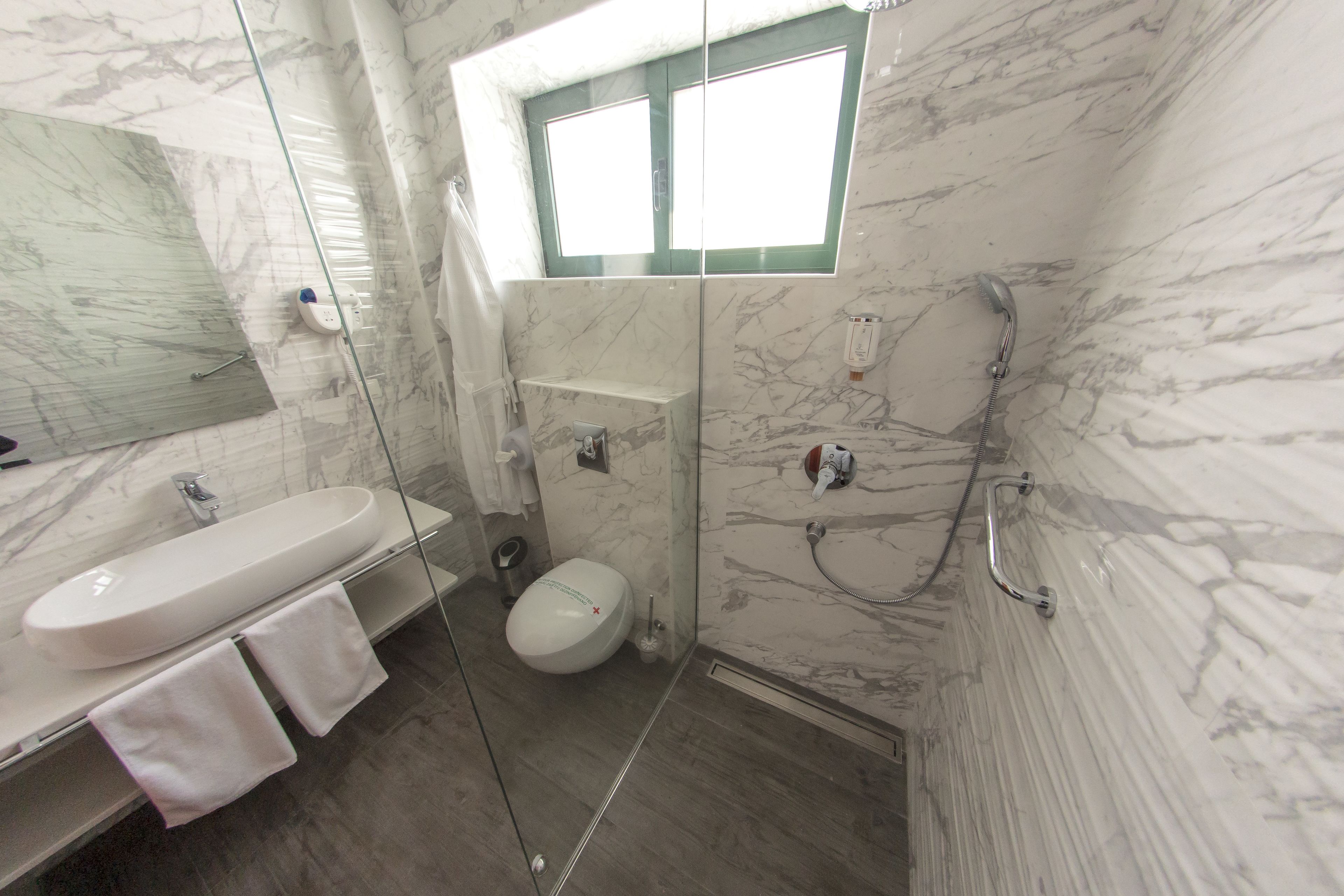 shower, free toiletries, dressing gowns, towels