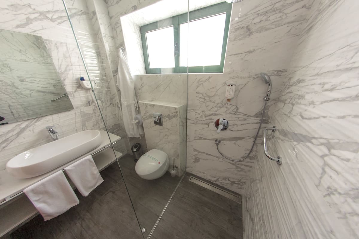 shower, free toiletries, dressing gowns, towels