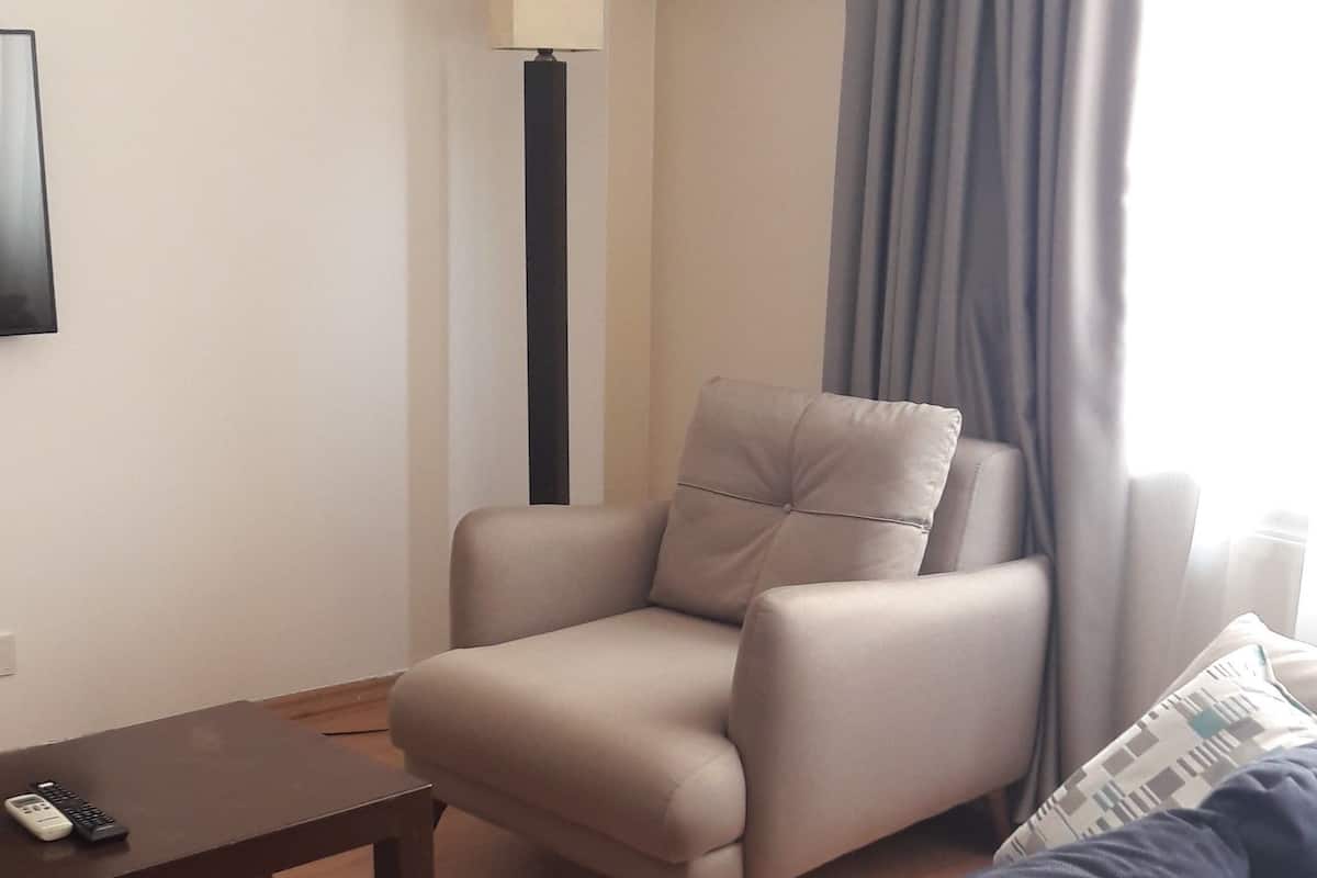 Premium bedding, blackout curtains, iron/ironing board (on request)