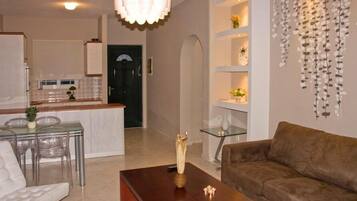 Suite, 1 Bedroom, Partial Sea View | Living area | 32-inch plasma TV with satellite channels, TV, offices