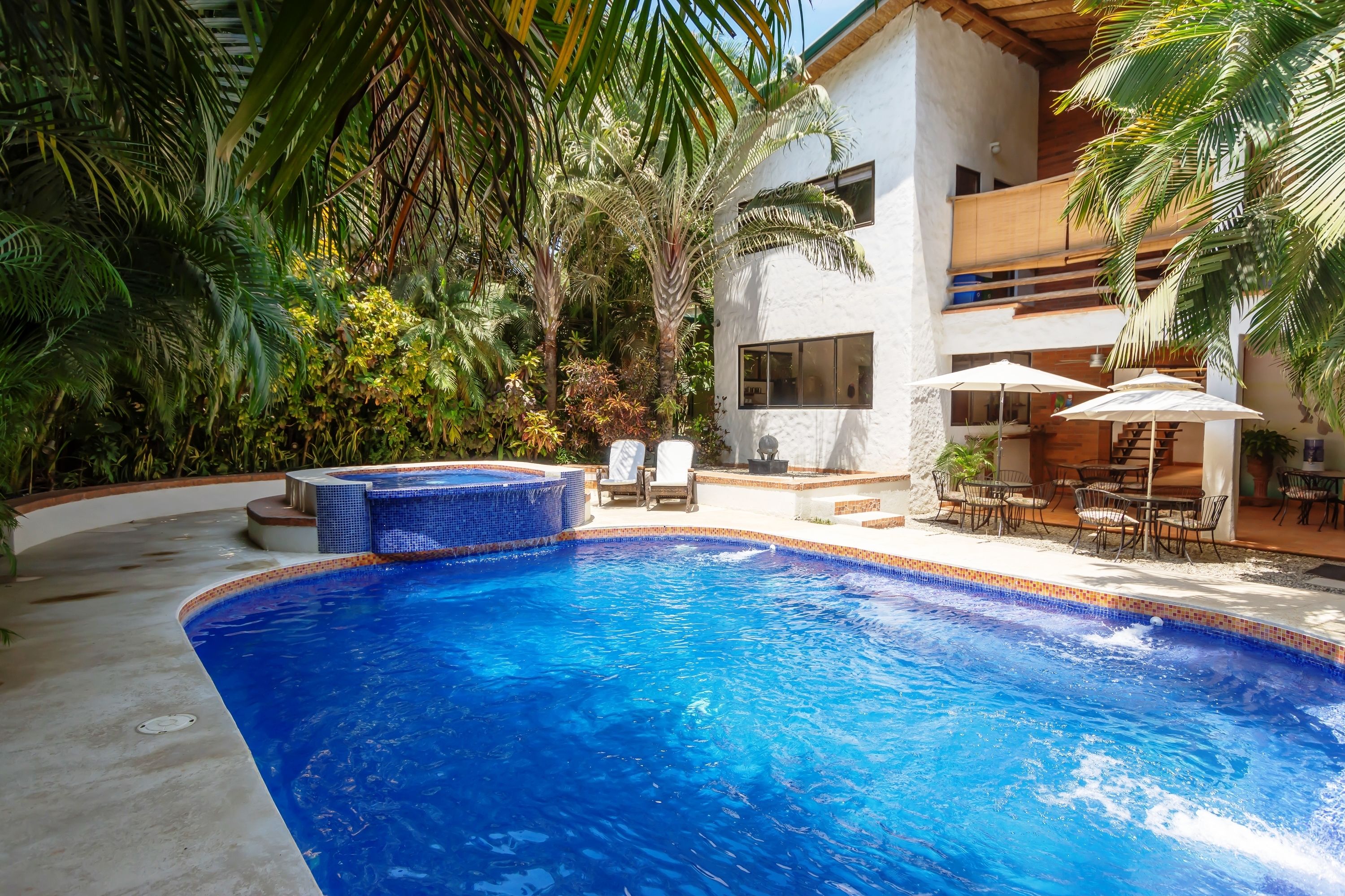 Outdoor pool, pool umbrellas, sun loungers