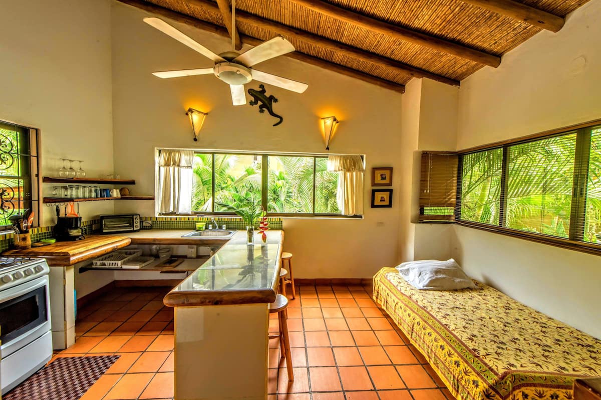 superior apartment, kitchen, garden view | private kitchenette | full-sized fridge, coffee/tea maker, electric kettle, dining tables