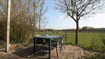 Panorama-studiolejlighed - 1 queensize-seng - udsigt til have (Framboos) | Terrasse/gårdhave