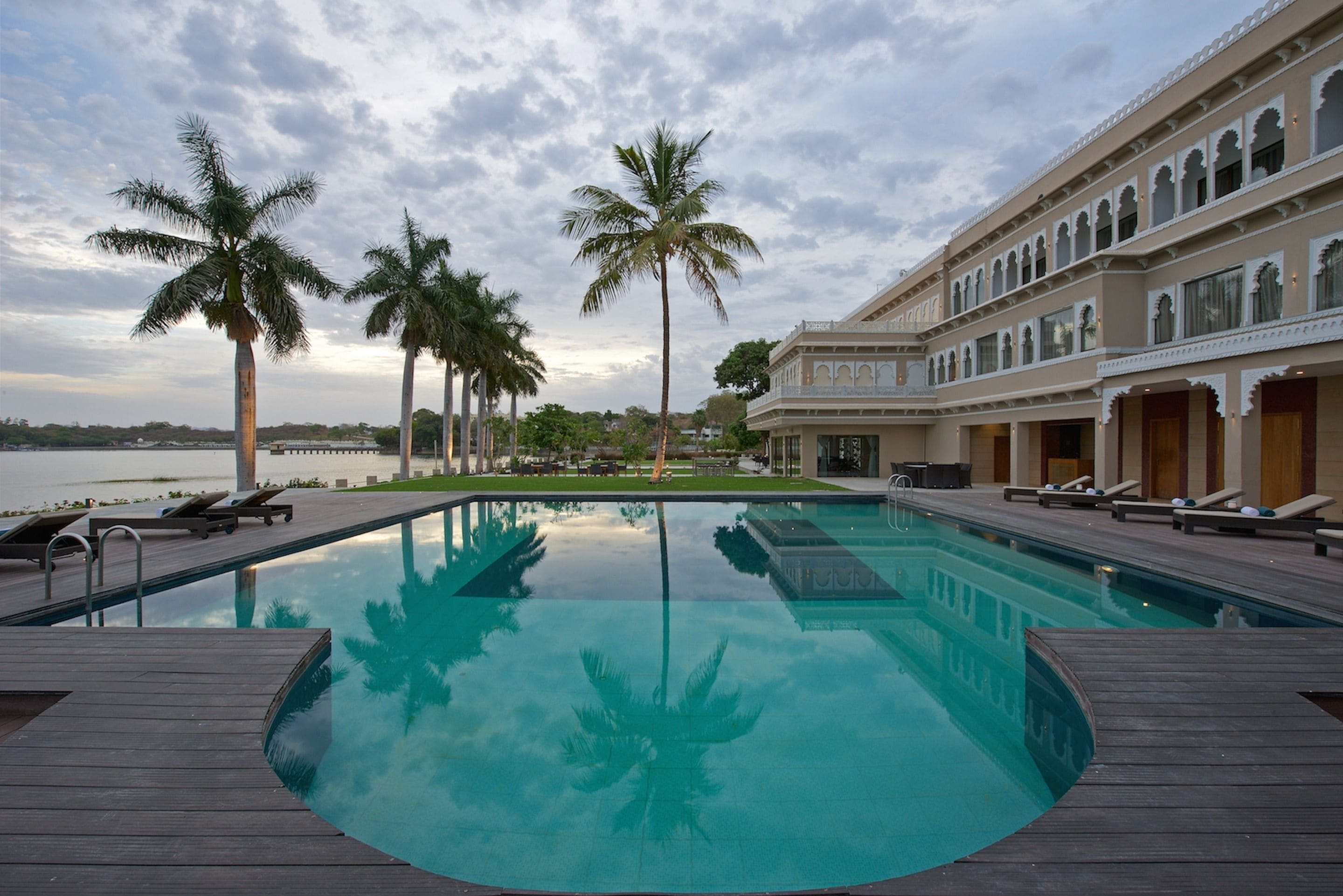 Outdoor pool, open 7:00 AM to 7:00 PM, pool umbrellas, sun loungers