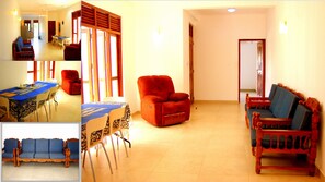 Apartamento família, 2 quartos, vista para a cidade, ao lado da praia | Área de estar | TV de tela plana