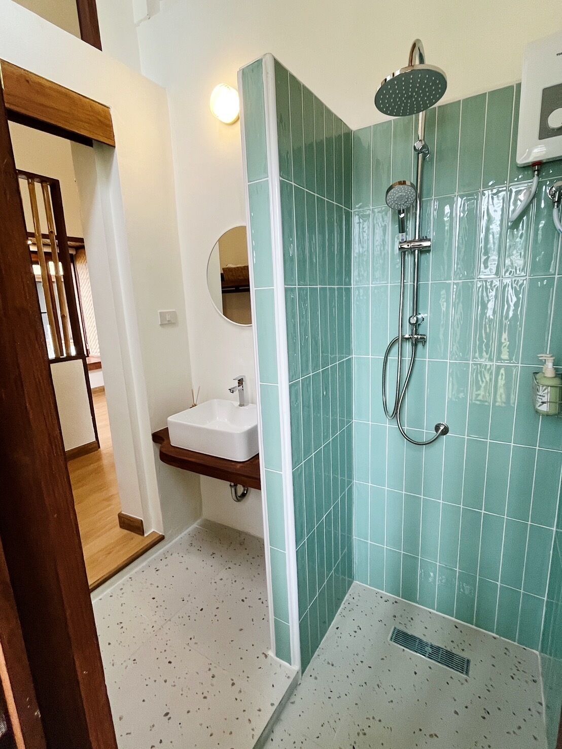 deluxe cottage | bathroom | rainfall showerhead, hair dryer, towels, soap