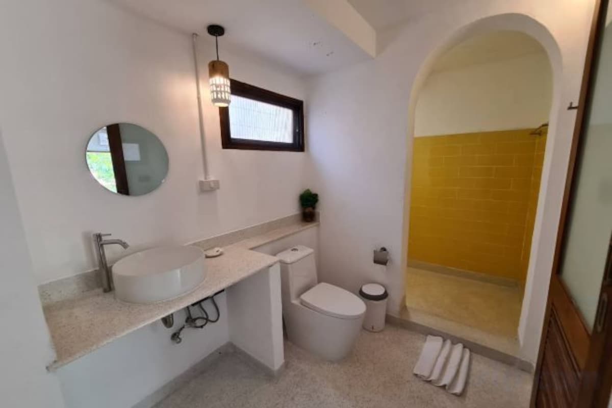Bathroom | Shower, rainfall showerhead, hair dryer, towels