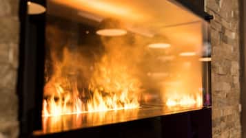 A fireplace with visible flames.