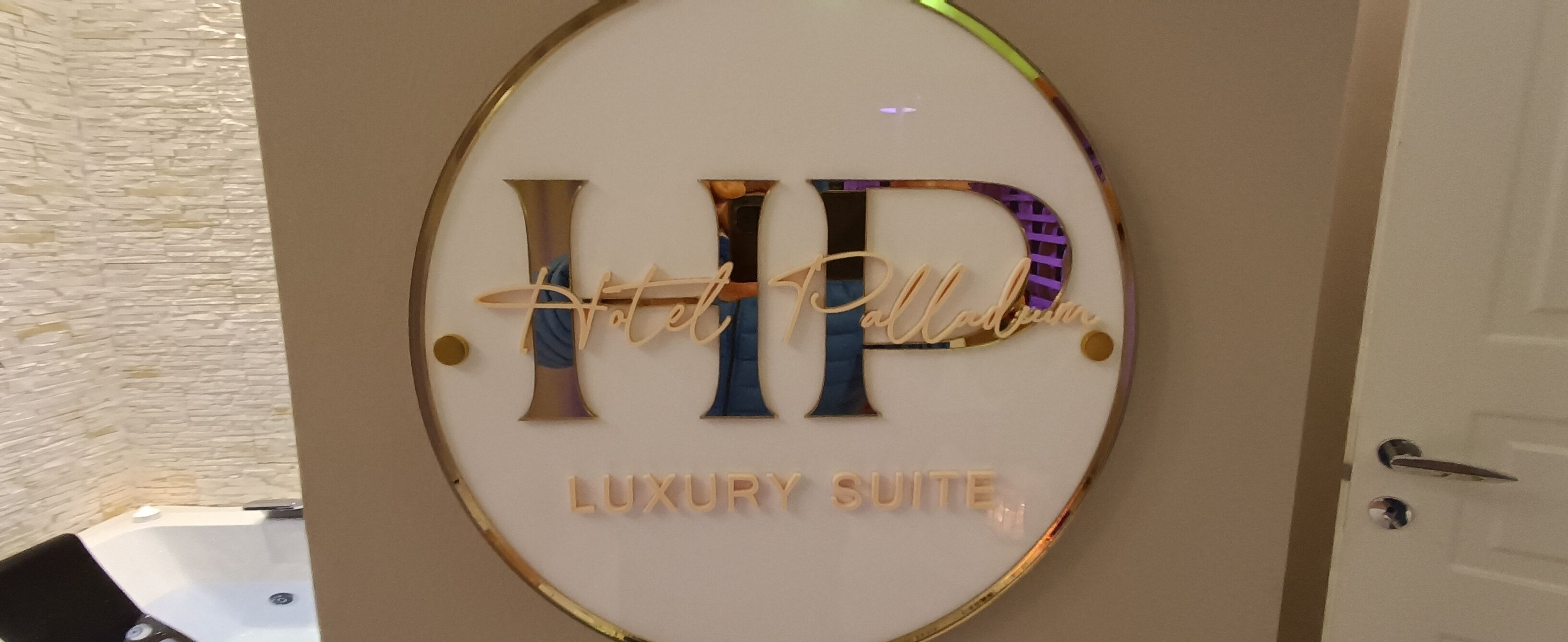 A sign with the letters "HP" and the words "Luxury Suite" indicating a high-end accommodation area.
