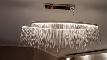 A modern chandelier with multiple hanging light fixtures.