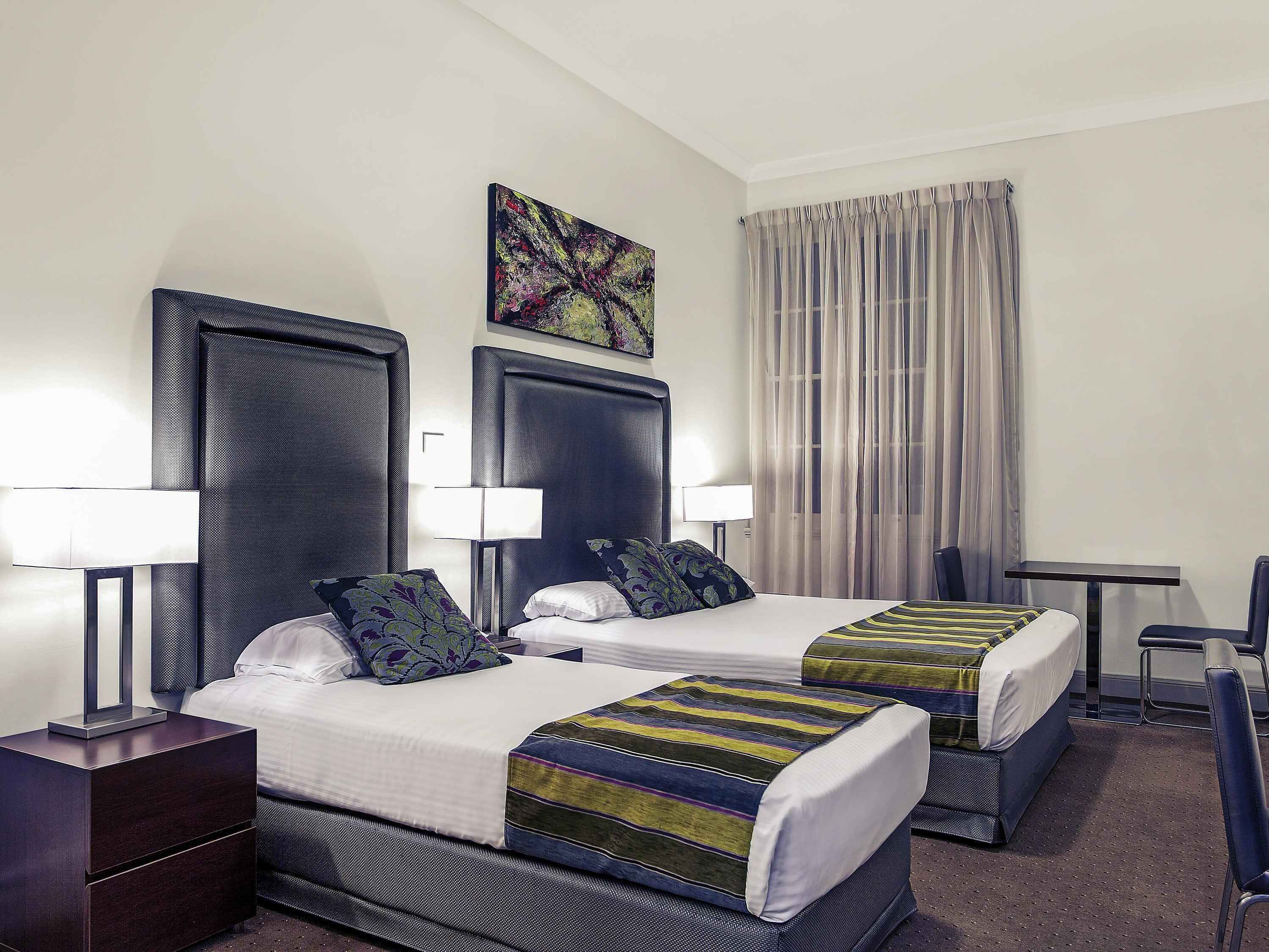 Standard Room, Multiple Beds | Minibar, in-room safe, individually decorated, individually furnished