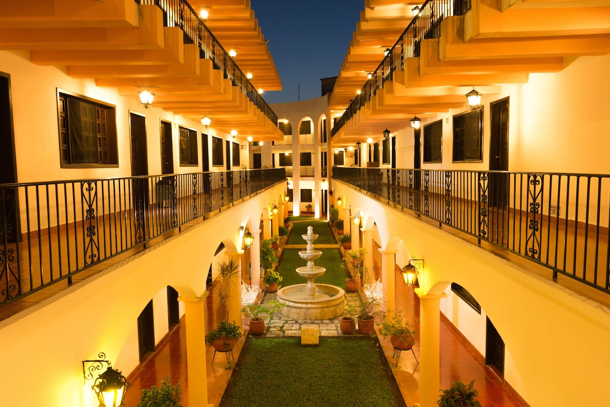 Hotel Zaci Valladolid Mexico rooms and courtuard at night