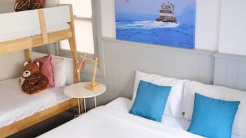 Family Room, Shared Bathroom | 1 bedroom, desk, laptop workspace, blackout drapes