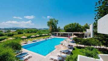 Outdoor pool, open 10:00 AM to 6:00 PM, pool umbrellas, pool loungers