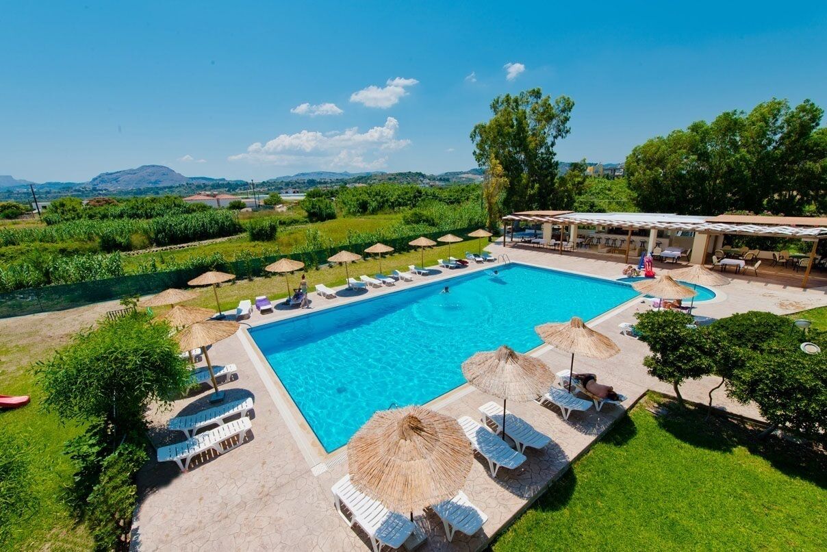 Outdoor pool, open 10:00 AM to 6:00 PM, pool umbrellas, sun loungers