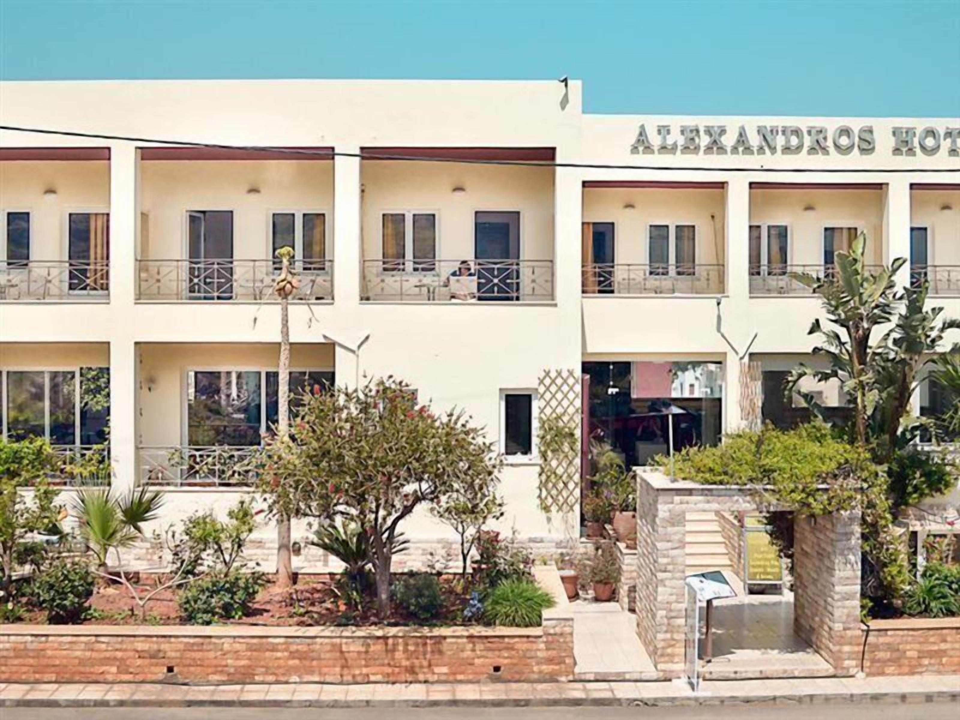 A multi-story hotel named 'Alexandros Hotel' with balconies, a garden area, and a visible entrance.