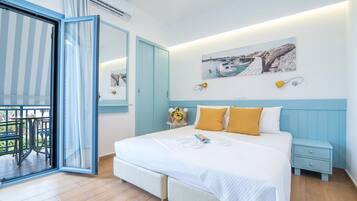 A bedroom with a large bed, a nightstand, a chair, and a view of the outdoors through a sliding door.