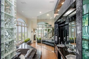 Hydromassage showerhead, designer toiletries, hair dryer, bathrobes