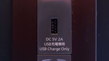A USB charge-only power outlet with a label indicating it is for USB charging only.