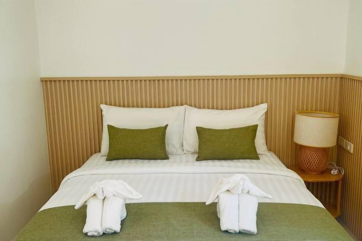 Premium bedding, desk, laptop workspace, free WiFi