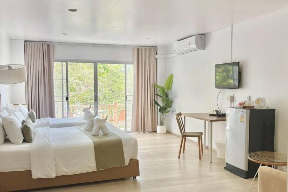 Premium bedding, desk, laptop workspace, free WiFi