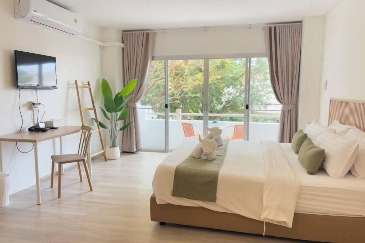 Premium bedding, desk, laptop workspace, free WiFi