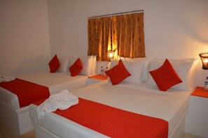 Deluxe Quadruple Room, 1 Bedroom, Garden View | 1 bedroom, individually furnished, iron/ironing board