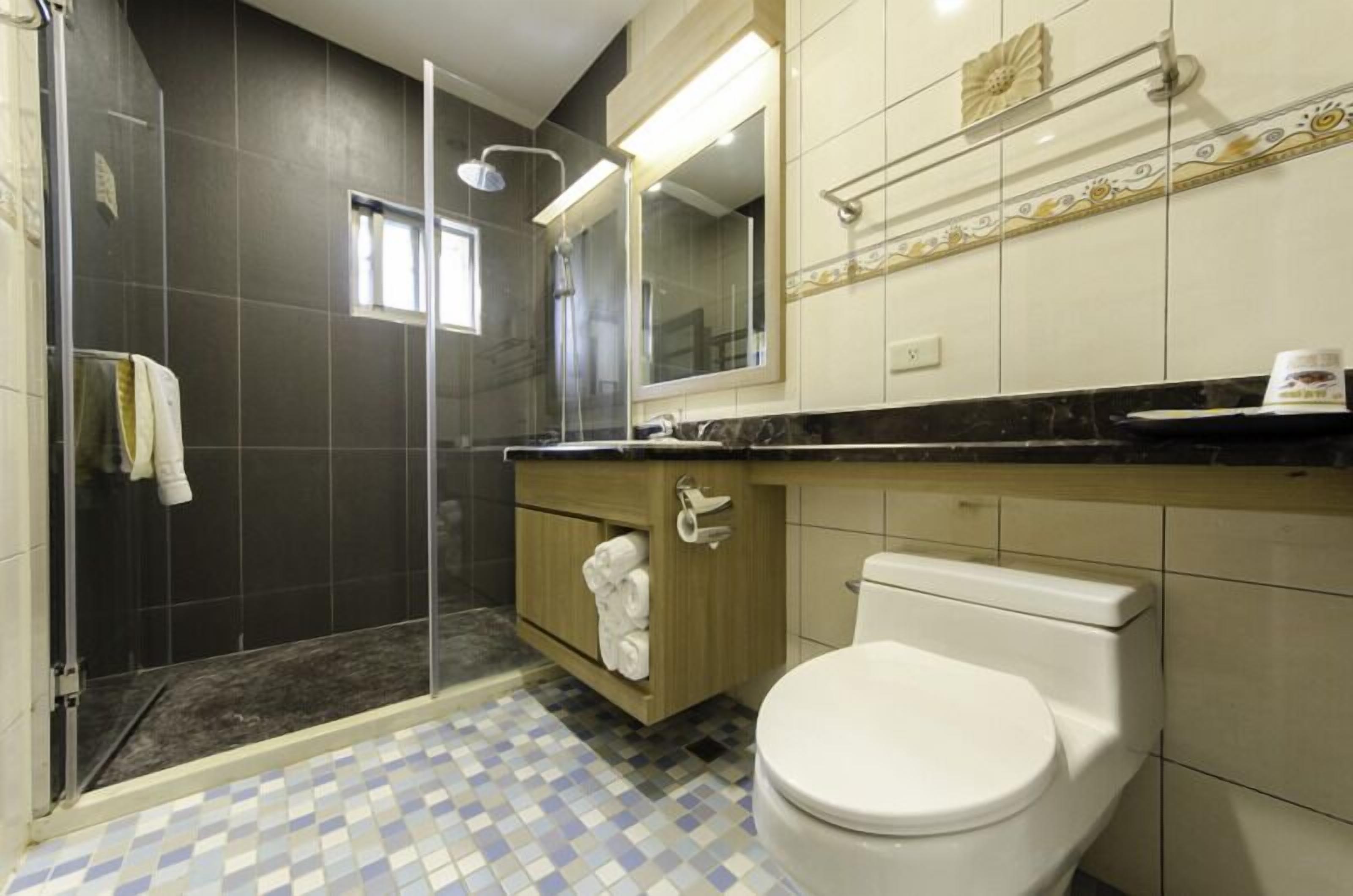 quadruple room | bathroom | shower, free toiletries, hair dryer, slippers