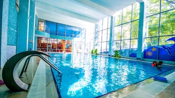 Indoor pool, open 10:00 AM to 6:00 PM, pool loungers