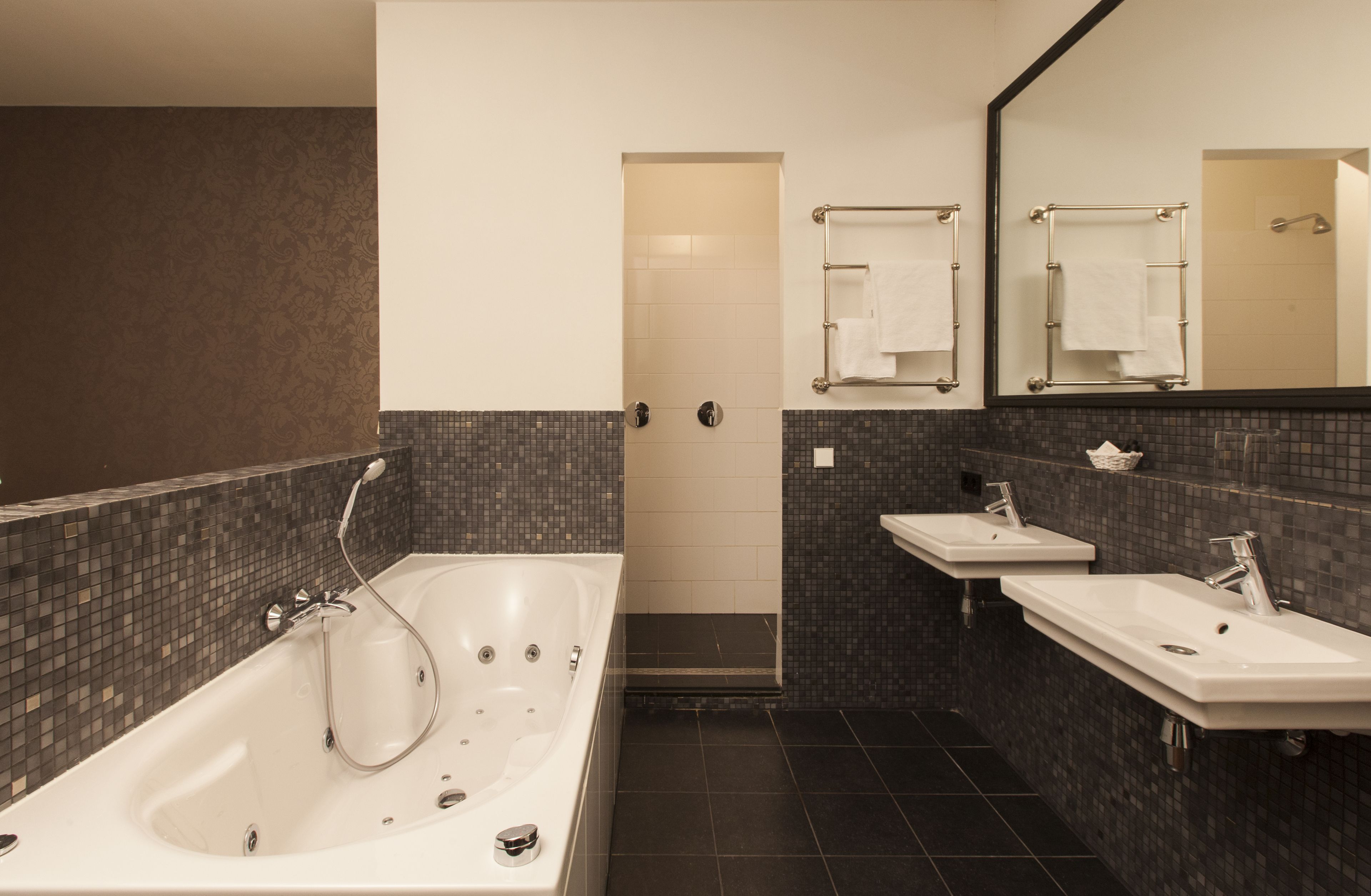 designer toiletries, hair dryer, towels, shampoo