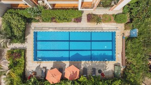 Outdoor pool, open 9:00 AM to 6:00 PM, pool umbrellas, pool loungers