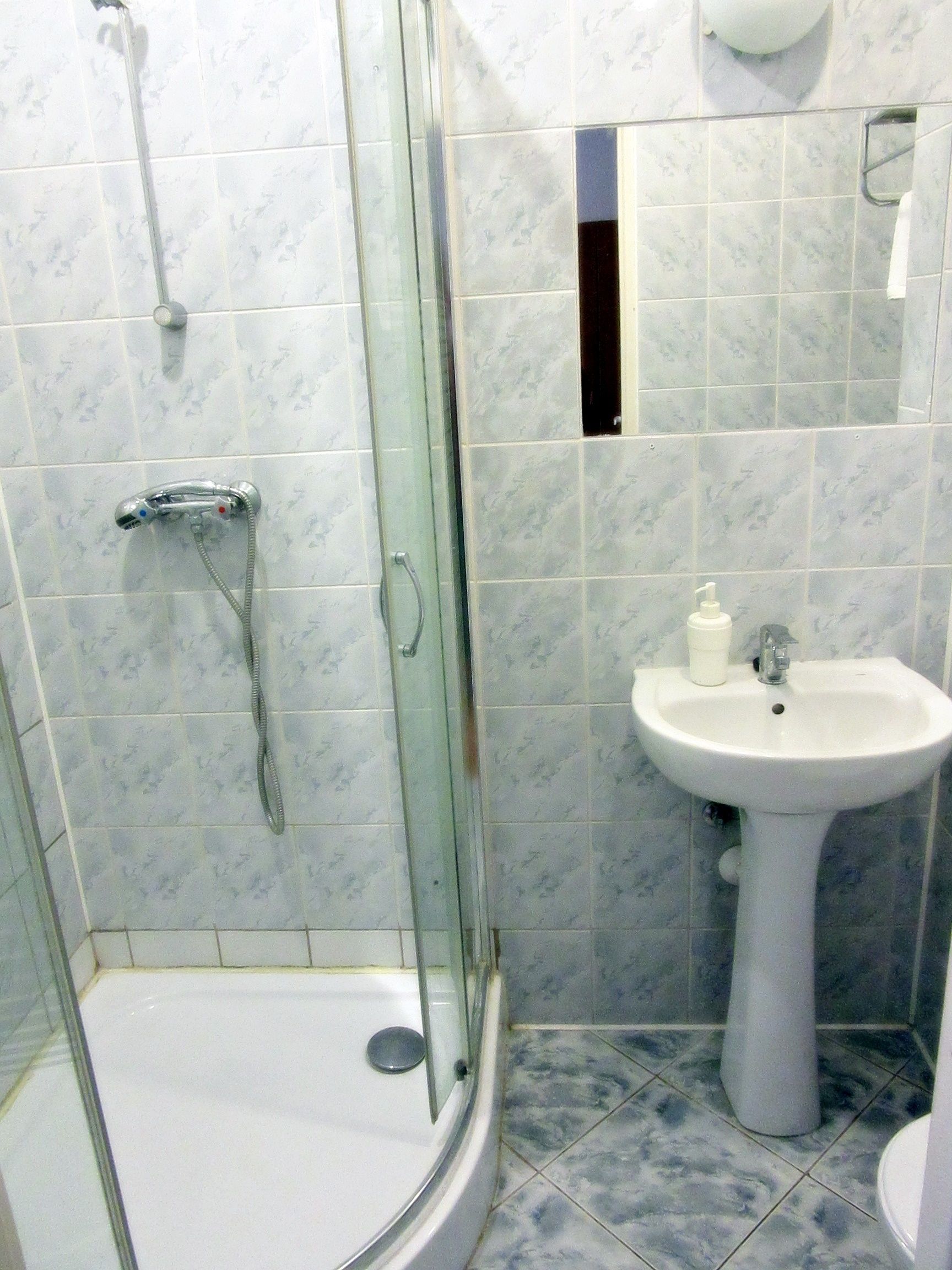 economy twin room | bathroom | shower, hair dryer, towels