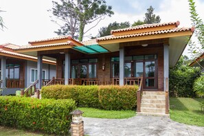 A two-story building with a wooden facade, large windows, and a covered porch area. - Lanta Lapaya Resort (Ko Lanta)
